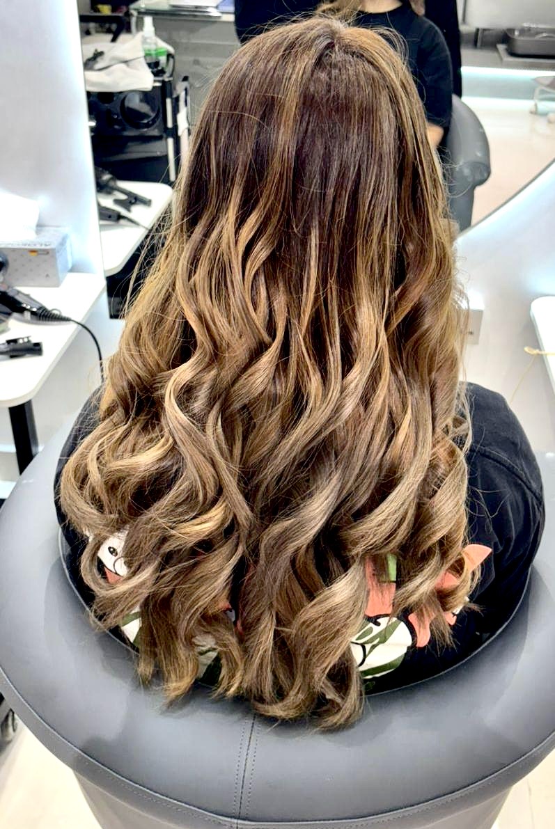 Long wavy hair styling at 22 Shades Beauty Lounge